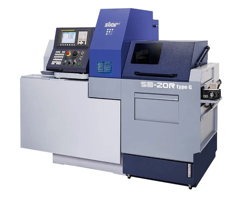 Macchina industriale di precisione per lavorazione dei metalli, modello SB-20R, colore blu e grigio, con pannello di controllo e display digitale.